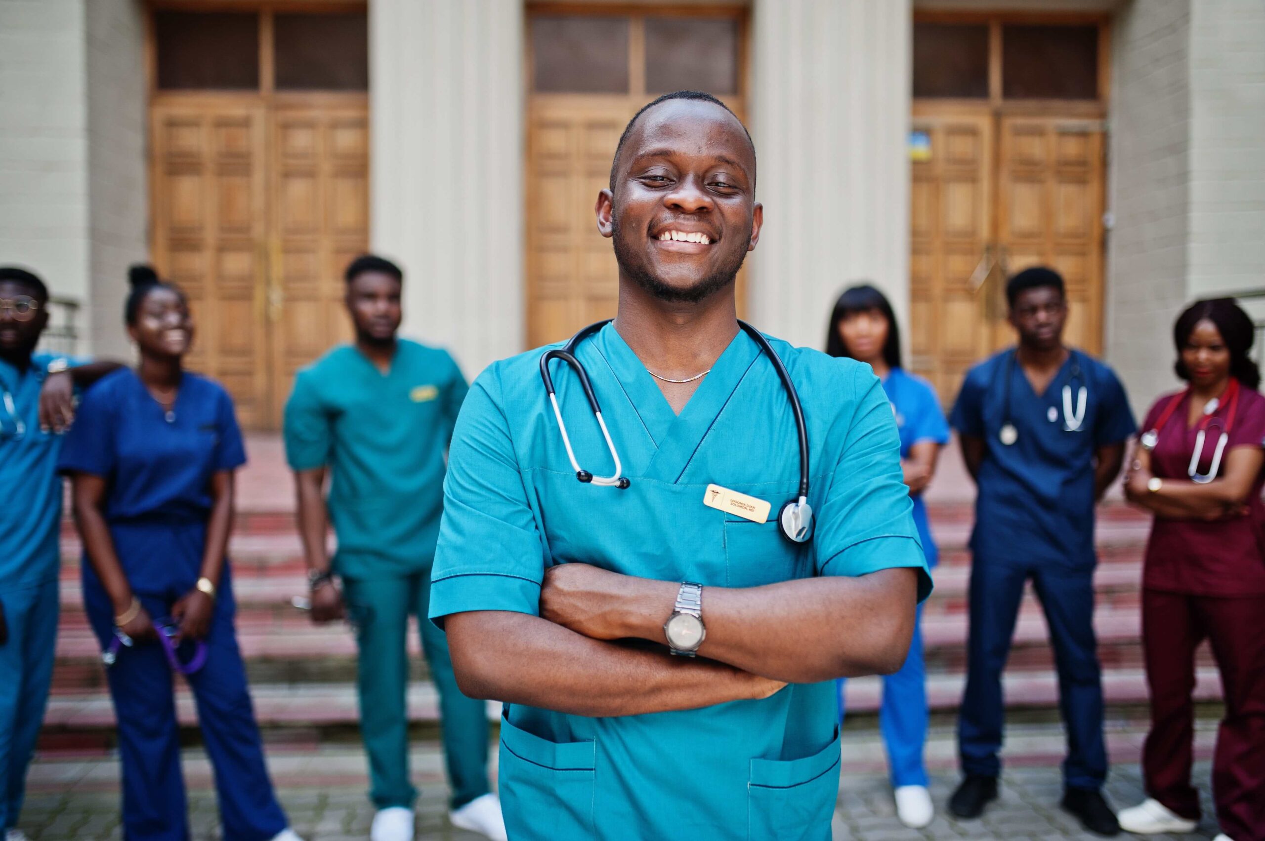 group-african-medical-students-posed-outdoor-against-university-door-min